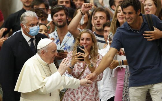 Pope Francis greets young people during his general audience in the Paul VI hall at the Vatican Sept. 1. (CNS/Paul Haring)