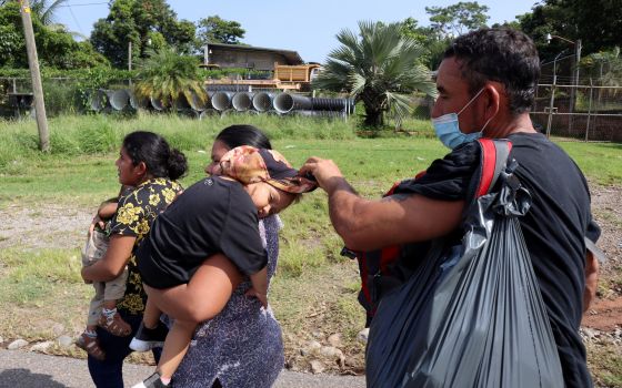 Migrants and asylum-seekers from Central America and the Caribbean walk in a caravan in Tapachula, Mexico, Aug. 28, 2021. They are headed to the Mexican capital to apply for asylum and refugee status. (CNS photo/Jose Torres, Reuters)