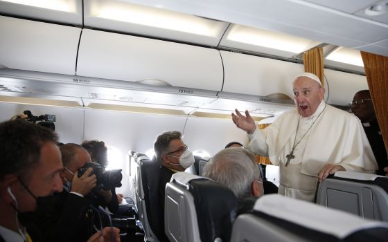 Pope Francis answers questions from journalists aboard his flight from Bratislava, Slovakia, to Rome Sept. 15, 2021. (CNS photo/Paul Haring)