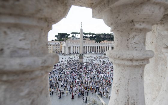 People in St. Peter's Square attend Pope Francis' recitation of the Angelus from the window of his studio overlooking the square at the Vatican Sept. 19, 2021. (CNS photo/Vatican Media)