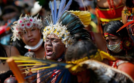 Brazilian Indigenous people take part in the second march of Indigenous women to protest against President Jair Bolsonaro in Brasilia Sept. 10. An estimated 6,000 Indigenous people, along with Catholic church leaders, camped in Brazil's capital for more t