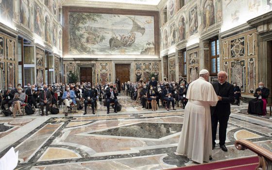 Pope Francis greets Archbishop Vincenzo Paglia during a meeting with members of the Pontifical Academy for Life in the Clementine Hall of the Apostolic Palace at the Vatican Sept. 27. (CNS/Vatican Media)