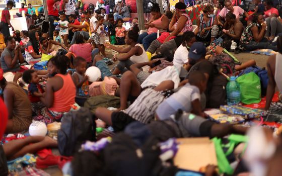 Haitian migrants trying to reach the U.S. rest outside a shelter Sept. 24 after arriving in Monterrey, Mexico. (CNS/Reuters/Edgard Garrido)