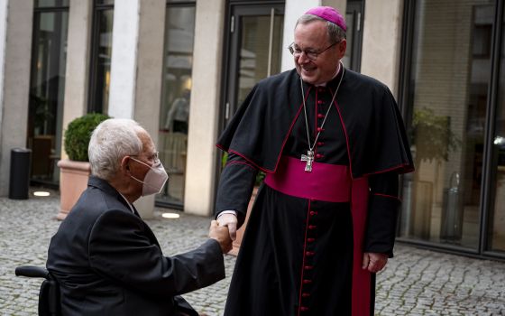 Bishop Georg Bätzing, president of the German bishops' conference, welcomes Wolfgang Schäuble, president of the Bundestag, the German federal parliament, at the annual St. Michael's reception in Berlin Sept. 27, 2021. In an address at the conference, Bish