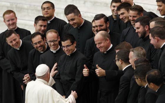 Pope Francis greets seminarians from the Pontifical North American College during his general audience in the Paul VI hall at the Vatican Sept. 29, 2021. Father Peter Harman, rector of the U.S. seminary, is seen giving a thumbs up. (CNS photo/Paul Haring)