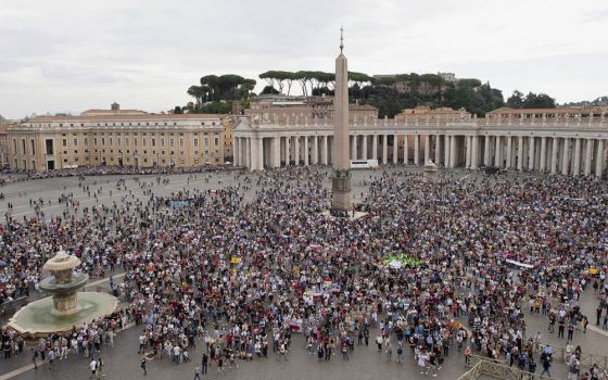 People attend the Angelus led by Pope Francis from the window of his studio overlooking St. Peter's Square at the Vatican Oct. 4. (CNS/Vatican Media)