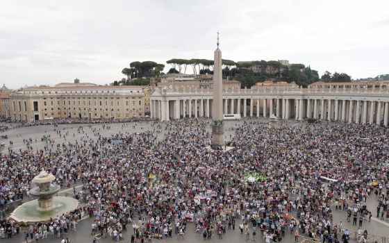 People attend the Angelus led by Pope Francis from the window of his studio overlooking St. Peter's Square at the Vatican Oct. 4, 2021. (CNS photo/Vatican Media)