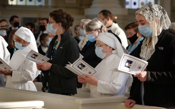 Guests including Little Sisters of the Poor sing during the entrance procession of Mass in the Chapel of the Immaculate Conception at Mundelein Seminary Oct. 17, 2021. (CNS photo/Karen Callaway, Chicago Catholic)