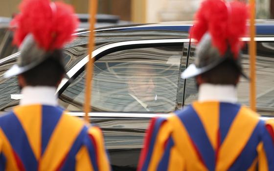 U.S. President Joe Biden looks out from the window of his limousine as he leaves the San Damaso Courtyard of the Apostolic Palace after a meeting with Pope Francis at the Vatican Oct. 29. (CNS/Paul Haring)
