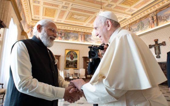 Pope Francis shakes hands with Indian Prime Minister Narendra Modi during a meeting at the Vatican Oct. 30, 2021. (CNS photo/Vatican Media)