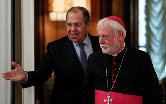 Russian Foreign Minister Sergei Lavrov enters a hall with Archbishop Paul Gallagher, Vatican secretary for relations with states, during their meeting in Moscow Nov. 9, 2021. (CNS photo/Yuri Kochetkov, pool via Reuters)