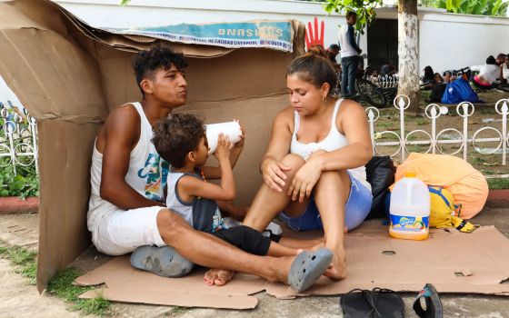  A migrant family in Huehuetán, Mexico, rests at a park with other caravan migrants heading to the U.S. border Nov. 18, 2021. (CNS photo/Jose Torres, Reuters)