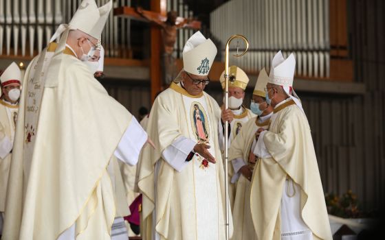Peruvian Archbishop Hector Miguel Cabrejos Vidarte, president of the Latin American bishops' council, or CELAM, gestures alongside prelates while concelebrating Mass during the opening of the Sixth Ecclesial Assembly of Latin America and the Caribbean at 