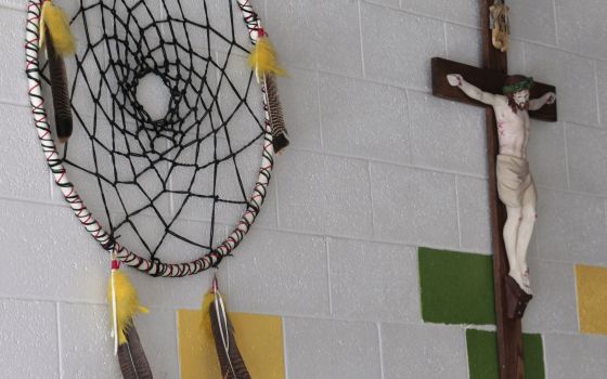 A dream catcher and crucifix are seen on the wall at St. Anthony Indian School on the Zuni Pueblo Indian reservation in New Mexico in this 2011 file photo. (CNS photo/Bob Roller)
