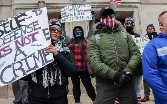 Protesters in Kenosha, Wisconsin, demonstrate outside of the Kenosha County Courthouse Nov. 16, as the jury deliberated in the trial of Kyle Rittenhouse. (CNS/Reuters/Evelyn Hockstein)