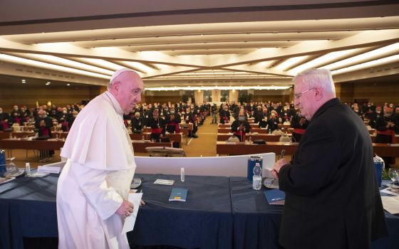 Pope Francis and Cardinal Gualtiero Bassetti of Perugia-Citta della Pieve, president of the Italian bishops' conference, attend the extraordinary general assembly of the Italian bishops on "the synodal journey of the church in Italy," in Rome Nov. 22, 202
