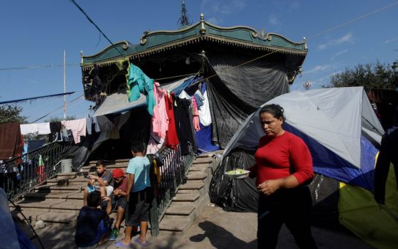Migrants seeking asylum in the U.S. camp in a public square in Reynosa, Mexico. In a Dec. 6 statement, the Mexican bishops expressed disappointment with their government's willingness to reinstate the Migrant Protection Protocols, known as Remain in Mexic