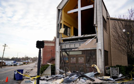 Debris surrounds a badly damaged church in Mayfield, Ky., Dec. 11, 2021, after a devastating tornado ripped through the town. (CNS photo/Cheney Orr, Reuters)