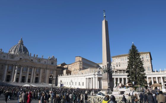 Pope Francis leads the Angelus from the window of his studio overlooking St. Peter's Square at the Vatican Dec. 12, 2021. (CNS photo/Vatican Media)