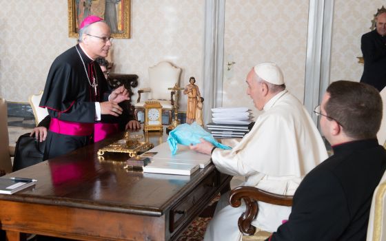 Pope Francis talks with Bishop Raymond Poisson of Saint-Jérôme and of Mont-Laurier, Quebec, president of the Canadian bishops' conference, during a meeting with officers of the conference at the Vatican Dec. 9, 2021. (CNS photo/Vatican Media)