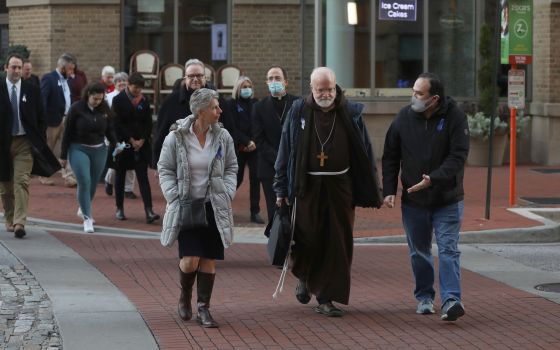 Cardinal Sean P. O'Malley of Boston, president of the Pontifical Commission for the Protection of Minors, leads a sunrise walk to end abuse, in Baltimore, Nov. 18, 2021. (CNS photo/Bob Roller)