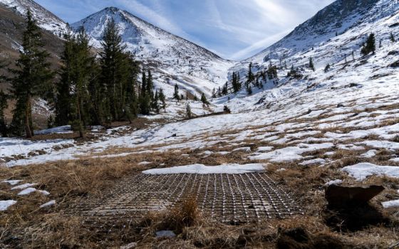 Snow pillows used for measuring snow water equivalent are covered with a bear net in the Kaweah Watershed at Southern Sequoia National Park in California, Nov. 18, 2021. (Kelly M. Grow/California Department of Water Resources)