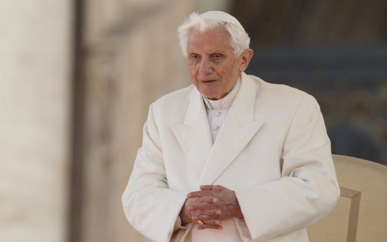 Pope Benedict XVI folds his hands during his final general audience in St. Peter's Square at the Vatican in this Feb. 27, 2013, file photo.
