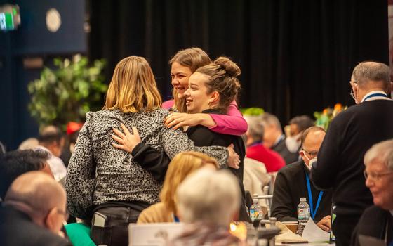 Women embrace on the final day of the second assembly of the Plenary Council of the Australian Catholic church in Sydney July 8. (CNS/The Catholic Weekly/Giovanni Portelli)