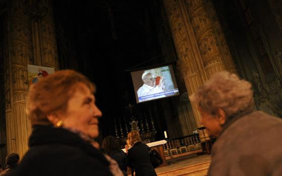 A TV screen in the Asti Cathedral shows Pope Francis March 13, 2013, the day he was elected at the Vatican. Pope Francis will travel to Asti Nov. 19-20 to help celebrate his cousin's 90th birthday and to celebrate Mass in the land where his father grew up. (CNS photo/Giorgio Perottino, Reuters)
