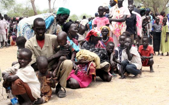 Displaced South Sudanese are pictured in a file photo waiting at a World Food Program outpost where thousands have taken shelter in Malakal, South Sudan. (CNS photo/Denis Dumo, Reuters)
