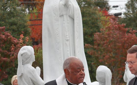 Washington Cardinal Wilton D. Gregory blesses a new statue of Our Lady of Fatima at the Rosary Walk and Garden outside the Basilica of the National Shrine of the Immaculate Conception Oct. 23, 2022.