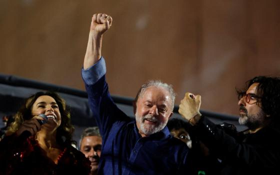 Luiz Inacio Lula da Silva lifts a raised fist at an election night gathering as he was proclaimed the winner in the Brazilian presidential election runoff, in São Paulo
