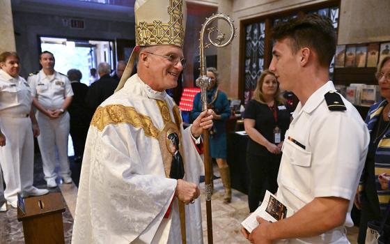 Archbishop Timothy Broglio of the U.S. Archdiocese for the Military Services greets a U.S. Naval Academy cadet midshipman after the annual Sea Services Pilgrimage Mass at the National Shrine of St. Elizabeth Ann Seton Oct. 2 in Emmitsburg, Maryland. (CNS/Courtesy of Devine Partners/Jason Minick)