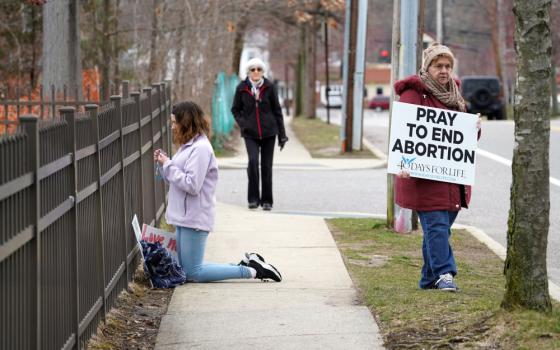 Pro-life advocates participate in a 40 Days for Life vigil near the entrance to a Planned Parenthood center in Smithtown, N.Y., March 19, 2020. (CNS photo/Gregory A. Shemitz)