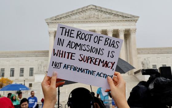 Supporters of affirmative action demonstrate near the U.S. Supreme Court building Oct. 31 in Washington. The court heard oral arguments in two cases challenging whether colleges may continue to use race as a factor in student admissions. (CNS/Reuters/Jonathan Ernst)