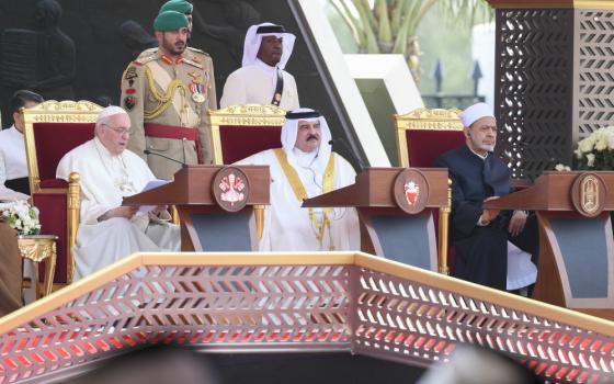 Pope Francis addresses the Bahrain Forum for Dialogue: East and West for Human Coexistence Nov. 4, 2022, in Awali, Bahrain. Bahrain's King Hamad bin Isa Al Khalifa and Sheikh Ahmad el-Tayeb, grand imam of Egypt's Al-Azhar mosque and university, look on. (CNS photo/Vatican Media)