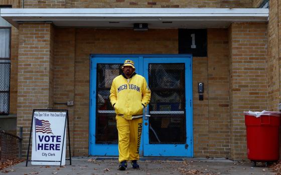 A Michigan voter leaves Louis Pasteur Elementary School on midterm election day in Detroit Nov. 8, 2022.