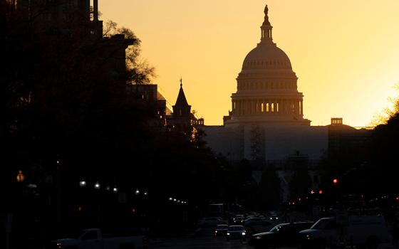 The sun rises over the U.S. Capitol Nov. 9 in Washington, the day after Election Day. (CNS/Reuters/Tom Brenner)