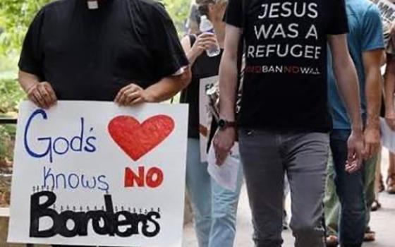 Father Guillermo Treviño, pastor of St. Joseph Church in West Liberty, Iowa, walks with members of the Iowa City Catholic Worker community to the office of U.S. Rep. Dave Loebsack, D-Iowa, to discuss immigration reform measures July 16, 2019. 