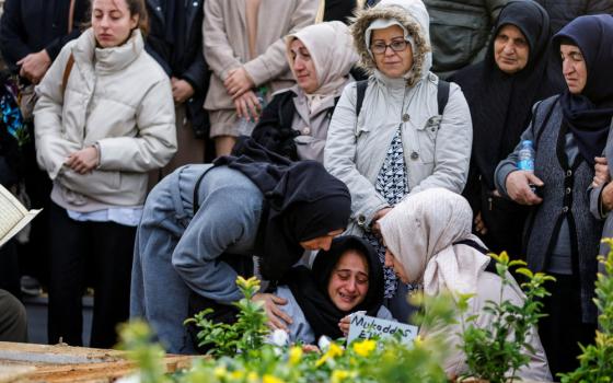 People in Istanbul attend the Nov. 14, 2022, funeral of Mukaddes Elif Topkara and Adem Topkara two of the six victims of a blast that took place Nov. 13 in a busy shopping district. 