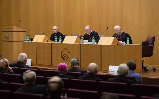 Curia officials -- Cardinal Luis Ladaria, prefect of the Dicastery for the Doctrine of the Faith; Cardinal Pietro Parolin, Vatican secretary of state; and Cardinal Marc Ouellet, prefect of the Dicastery for Bishops – meet Nov. 18, 2022, with the bishops of Germany making their "ad limina" visits to the Vatican. Other heads of Vatican dicasteries also attended the meeting across the street from the Vatican at the Augustinianum Institute for Patristic Studies. (CNS photo/Vatican Media)