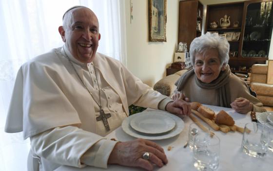 Pope Francis and Carla Rabezzana, his second cousin, sit down to lunch in her home in Portacomaro, near Asti, Nov. 19, 2022. 