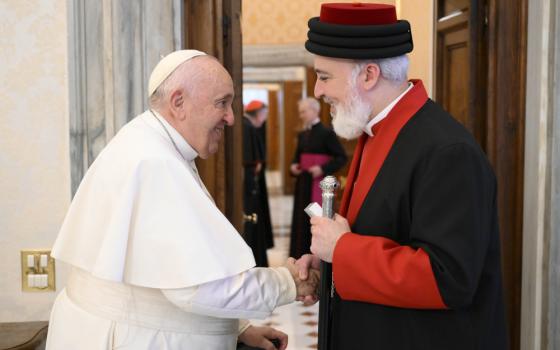 Pope Francis shakes hands with Catholicos Awa III, patriarch of the Assyrian Church of the East, at the end of a meeting Nov. 19, 2022, in the library of the Apostolic Palace at the Vatican. 