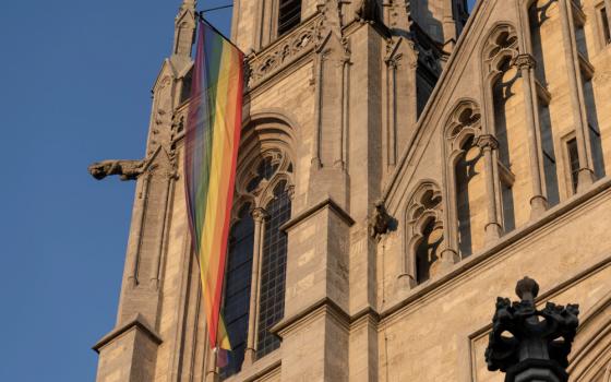 A LGBTQ flag hangs on St. Paul's Church in Munich 13, 2022. (CNS photo/Lukas Barth, Reuters)