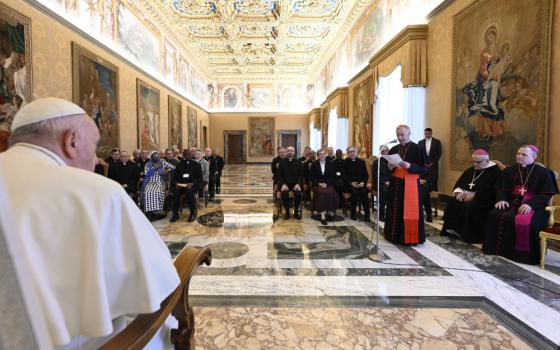 Pope Francis listens to Cardinal Luis Ladaria, prefect of the Dicastery for the Doctrine of the Faith and president of the International Theological Commission, during a meeting with commission members Nov. 24, 2022, in the Apostolic Palace of the Vatican. (CNS photo/Vatican Media)