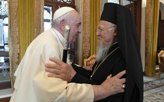 Pope Francis greets Ecumenical Patriarch Bartholomew of Constantinople at Sakhir Palace in Awali, Bahrain, in this Nov. 4, 2022, file photo. In a letter to Patriarch Bartholomew, Pope Francis said Christians must acknowledge how sin has exacerbated divisions and how growing in holiness is part of the search for Christian unity. (CNS photo/Vatican Media)