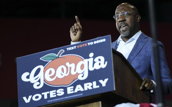 U.S. Sen. Raphael Warnock, D-Ga., candidate for U.S. Senate, speaks during a campaign rally Oct. 28, in College Park, Georgia. (AP photo/John Bazemore)