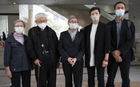 From left, former lawmaker Cyd Ho, Cardinal Joseph Zen, barrister Margaret Ng, singer Denise Ho and scholar Hui Po-keung pose for a photograph outside of the West Kowloon Magistrates's Courts