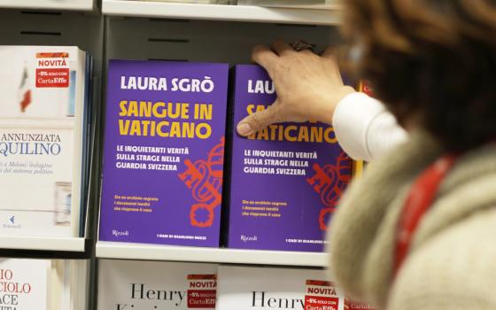 Copies of the book Sangue in Vaticano (Blood in The Vatican) by lawyer Laura Sgro', are displayed in a bookshop during its launch in Rome, Tuesday, Nov. 29, 2022. The book is about the case of Swiss Guard Corporal Cedric Tornay who allegedly committed suicide in the Vatican after killing guards' commander Alois Estermann and his Venezuelan wife Gladys Meza Romero in 1998. (AP Photo/Andrew Medichini)