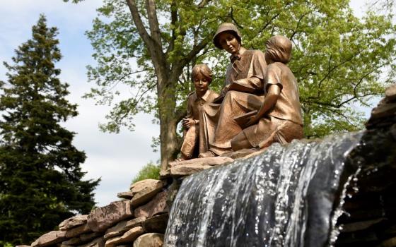 Statue of Mother Seton reading to children